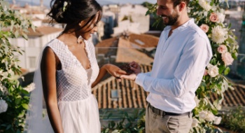 a bride and groom surrounded by their bridesmaids and groomsmen